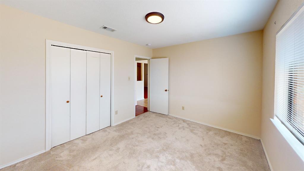 853 West Wintergreen Road Lancaster, TX 75134 - Photo 11 of 20 Neutral-toned walls, carpeted flooring, and a flush mount ceiling light fixture