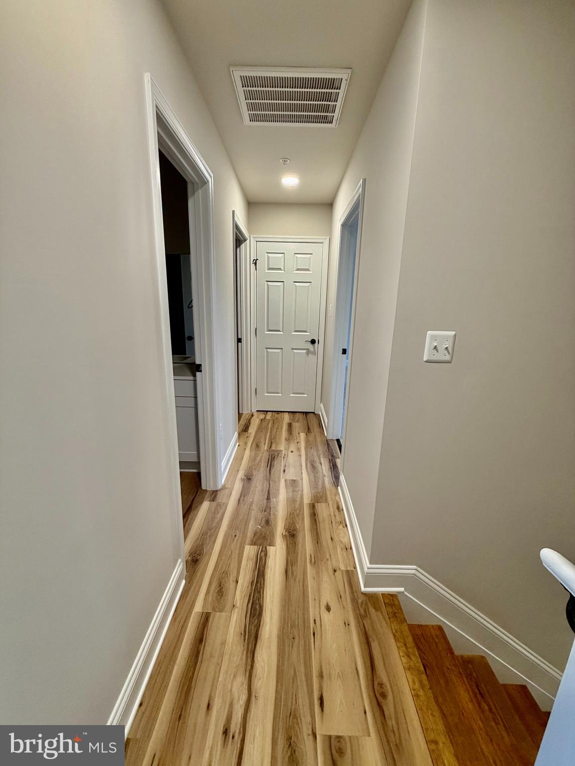 613 Santa Fe Trail Lusby, MD 20657 - Photo 11 of 24 a view of a hallway with wooden floor