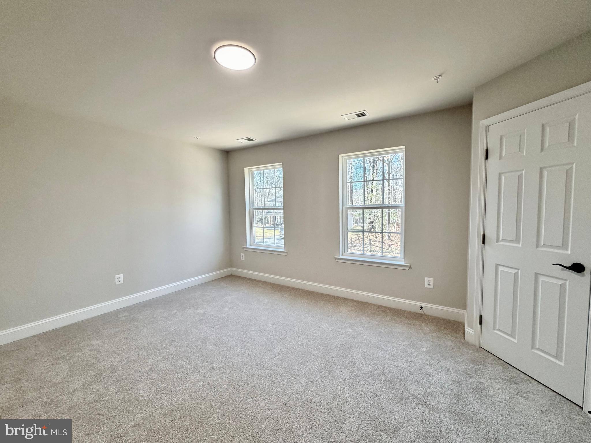 613 Santa Fe Trail Lusby, MD 20657 - Photo 12 of 24 an empty room with windows and closet