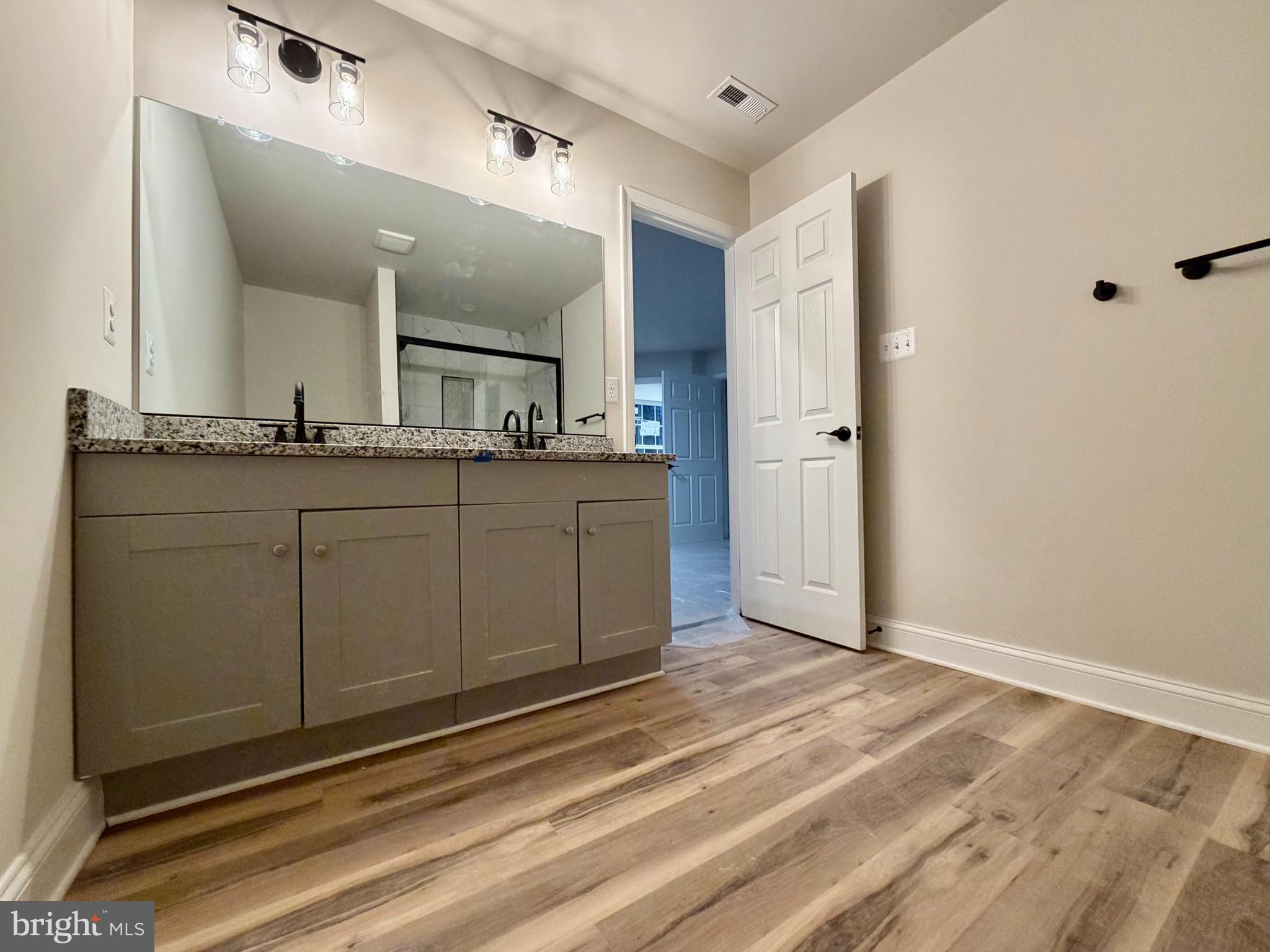 613 Santa Fe Trail Lusby, MD 20657 - Photo 13 of 24 a bathroom with a sink and a mirror