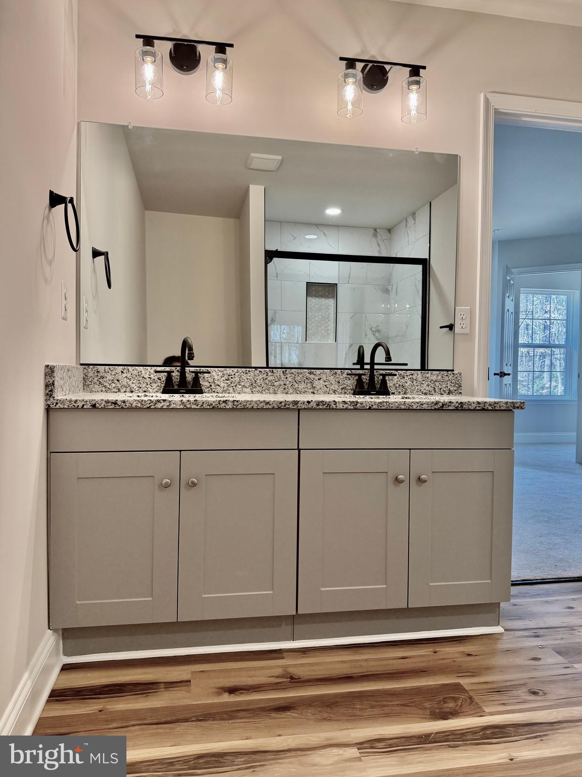 613 Santa Fe Trail Lusby, MD 20657 - Photo 15 of 24 a bathroom with a sink and a mirror