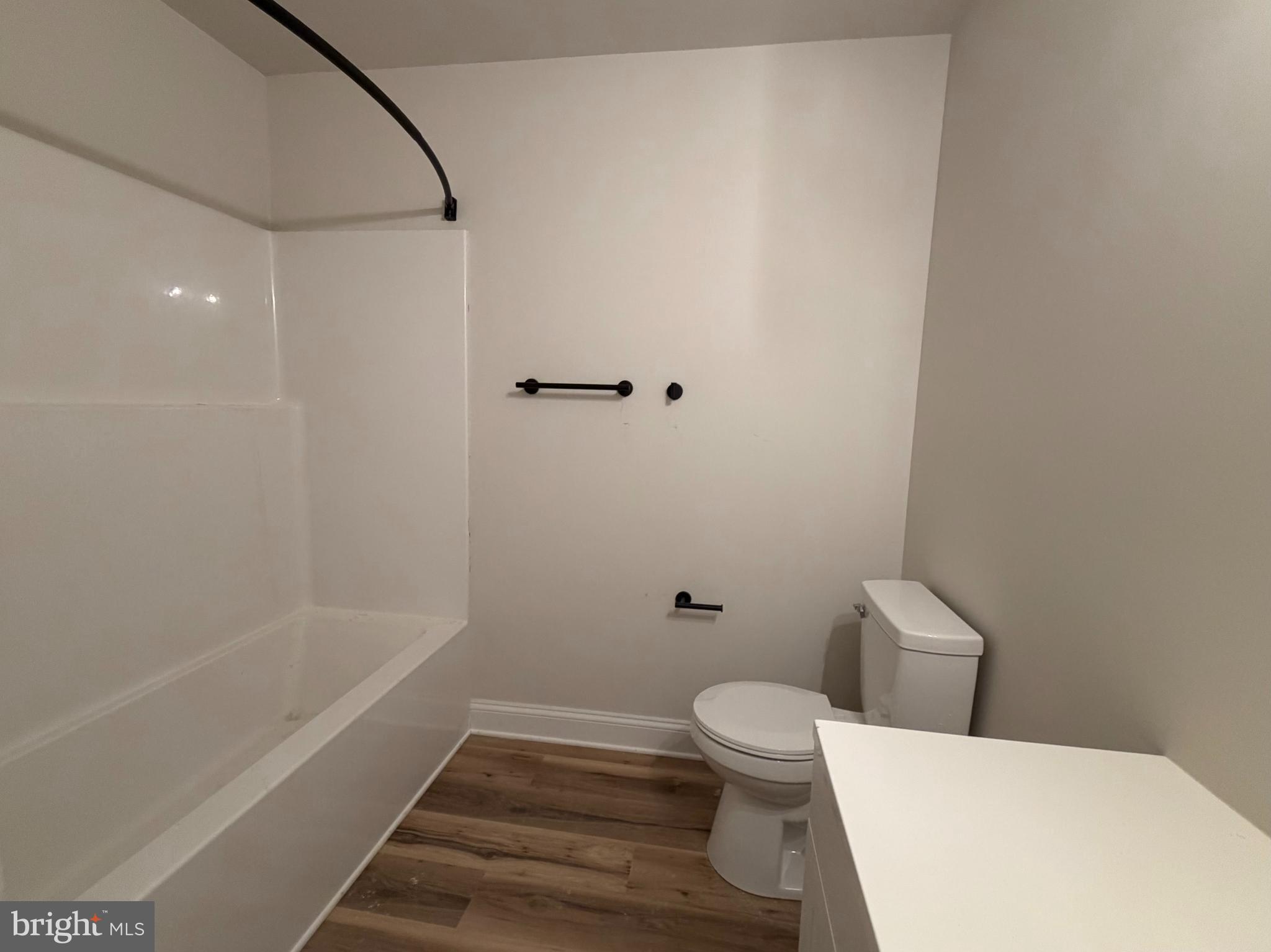 613 Santa Fe Trail Lusby, MD 20657 - Photo 19 of 24 a white toilet sitting next to a bath tub