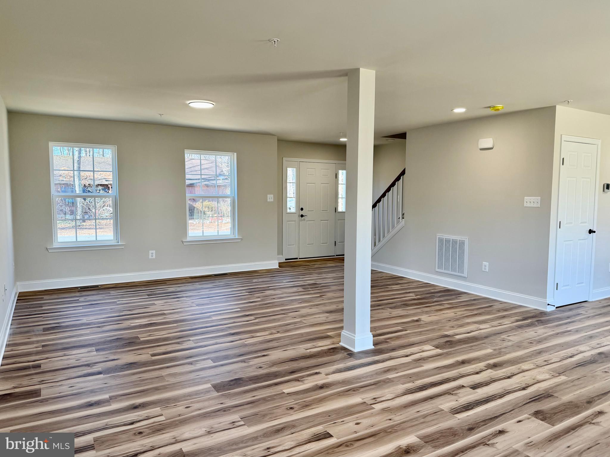 613 Santa Fe Trail Lusby, MD 20657 - Photo 2 of 24 a view of empty room with wooden floor and window