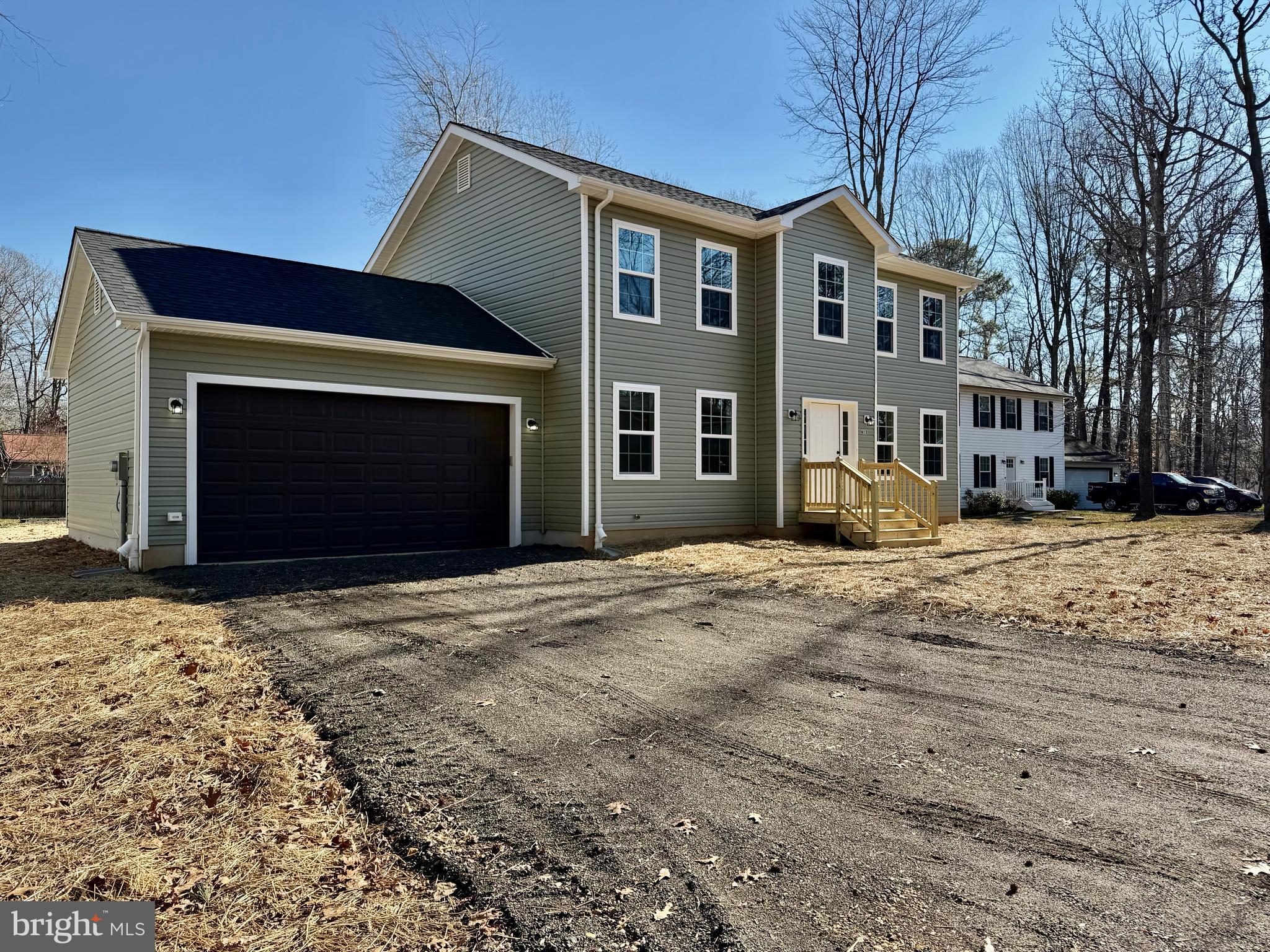 613 Santa Fe Trail Lusby, MD 20657 - Photo 24 of 24 a front view of a house with a yard