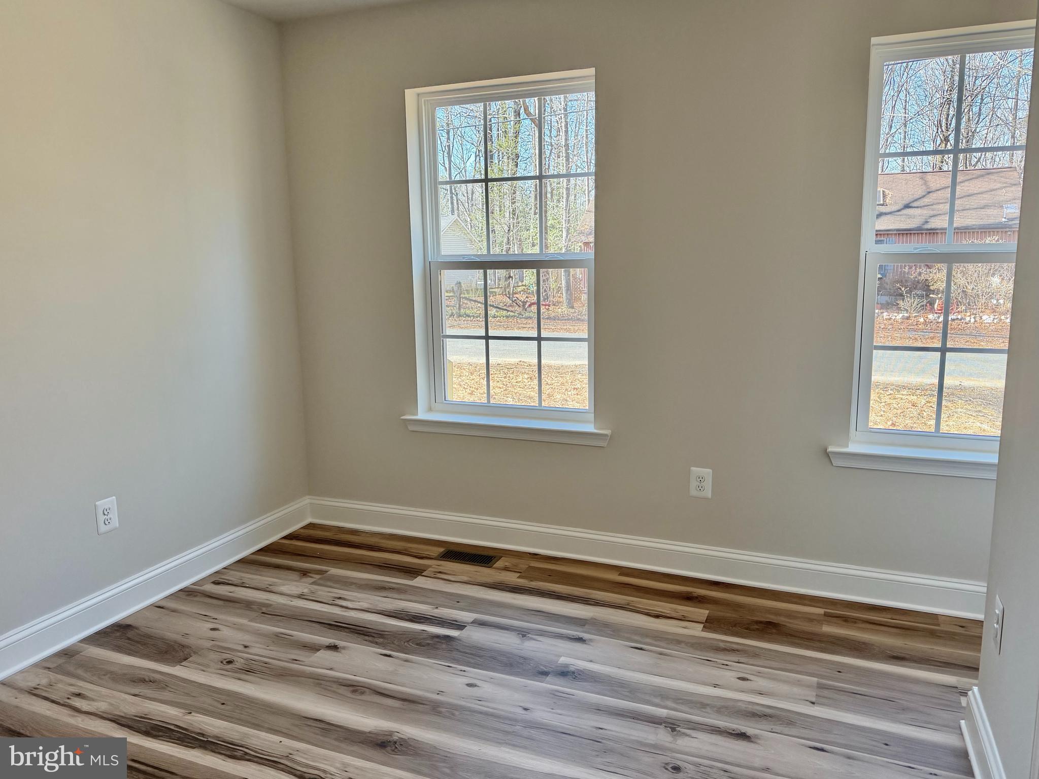 613 Santa Fe Trail Lusby, MD 20657 - Photo 8 of 24 a view of a room with wooden floor and windows