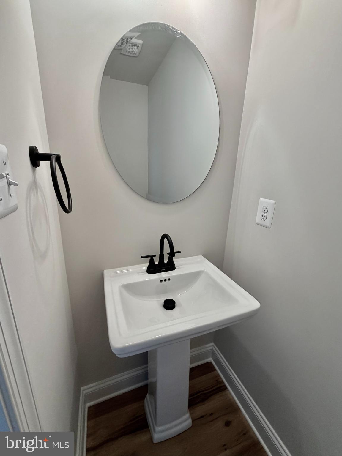 613 Santa Fe Trail Lusby, MD 20657 - Photo 9 of 24 a bathroom with a sink and a mirror