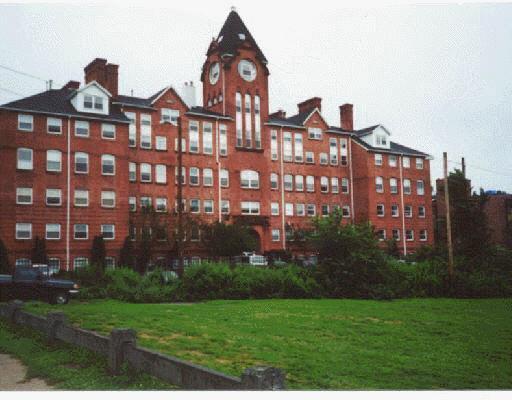 a view of a building with a yard