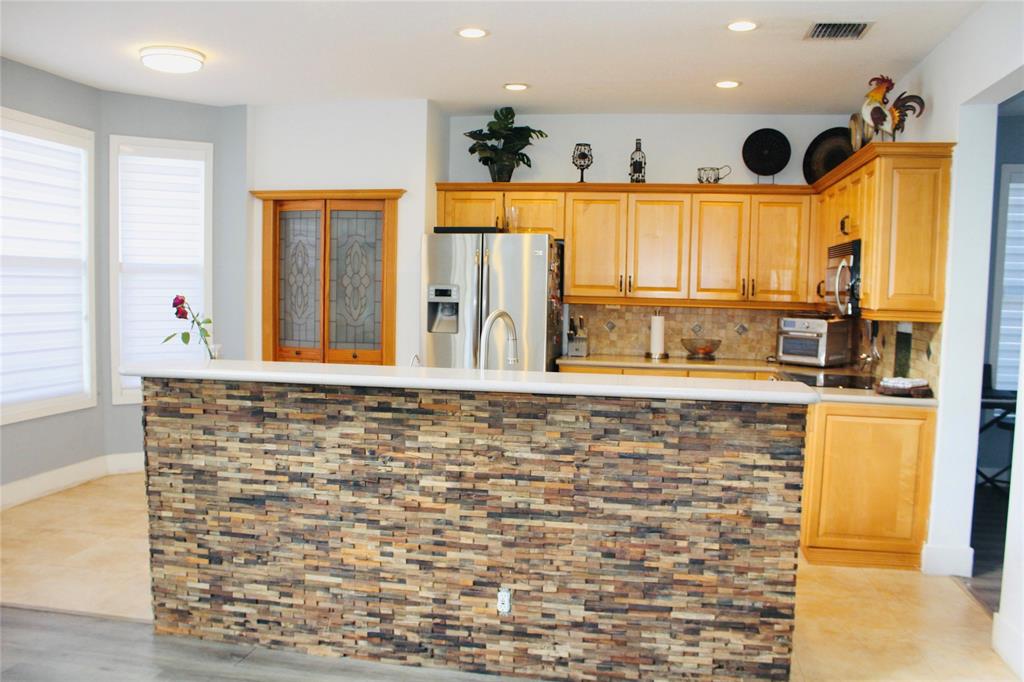 1512 Southwest 187th Terrace Pembroke Pines, FL 33029 - Photo 12 of 29 a bathroom with a granite countertop sink and a large mirror