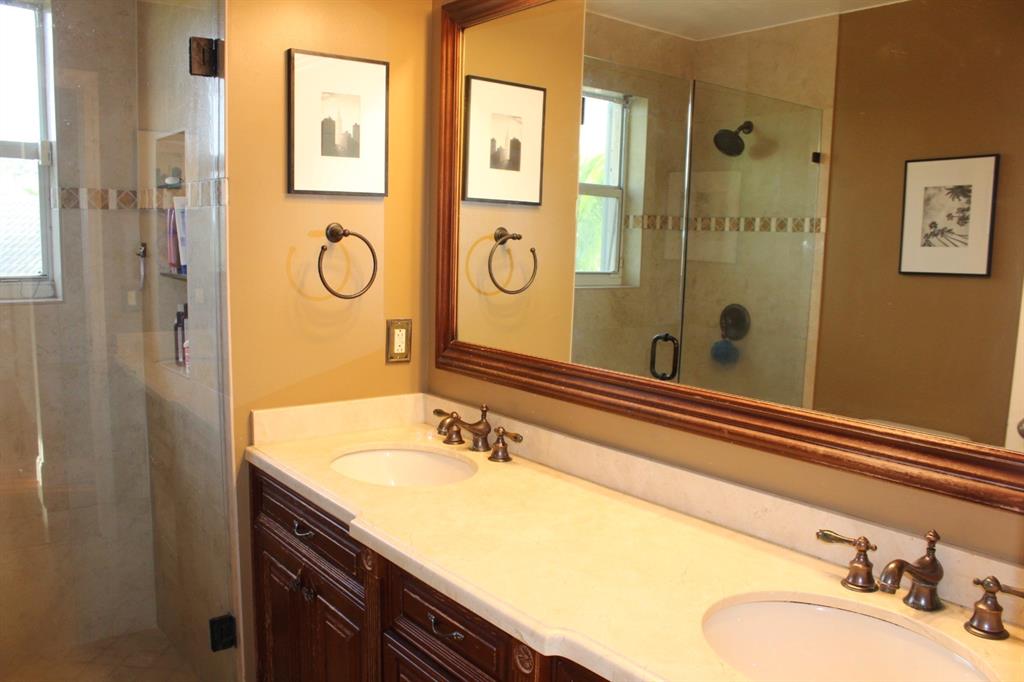 1512 Southwest 187th Terrace Pembroke Pines, FL 33029 - Photo 14 of 29 a bathroom with a granite countertop sink and a mirror