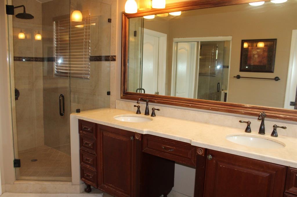 1512 Southwest 187th Terrace Pembroke Pines, FL 33029 - Photo 15 of 29 a bathroom with a double vanity sink mirror and shower