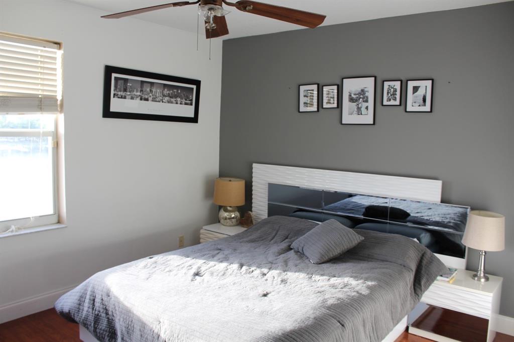 1512 Southwest 187th Terrace Pembroke Pines, FL 33029 - Photo 24 of 29 a bedroom with a bed and a window