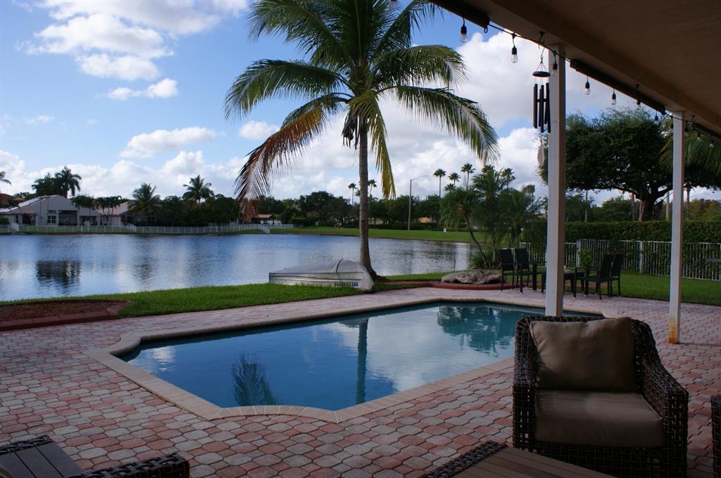 1512 Southwest 187th Terrace Pembroke Pines, FL 33029 - Photo 28 of 29 a view of outdoor space with swimming pool and patio