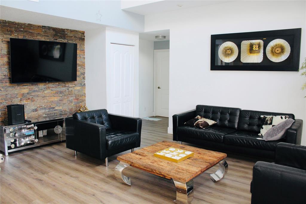 1512 Southwest 187th Terrace Pembroke Pines, FL 33029 - Photo 7 of 29 a living room with furniture and a flat screen tv