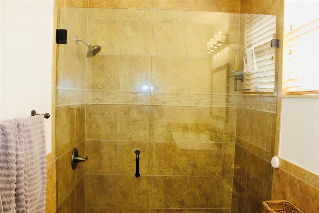 1512 Southwest 187th Terrace Pembroke Pines, FL 33029 - Photo 10 of 29 a bathroom with a shower