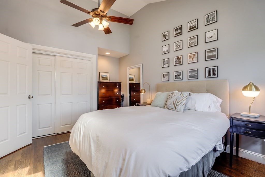 154 West 3rd Street, Unit 154 Boston, MA 02127 - Photo 17 of 26 a bedroom with a bed and a chandelier