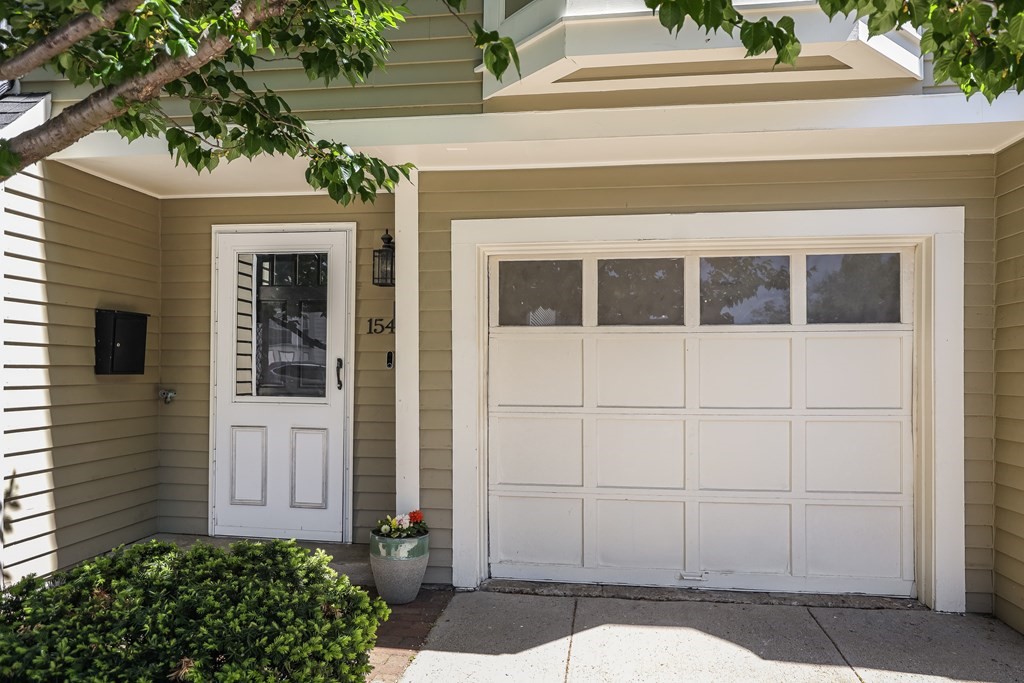 154 West 3rd Street, Unit 154 Boston, MA 02127 - Photo 2 of 26 a view of a house with a potted plant and a window