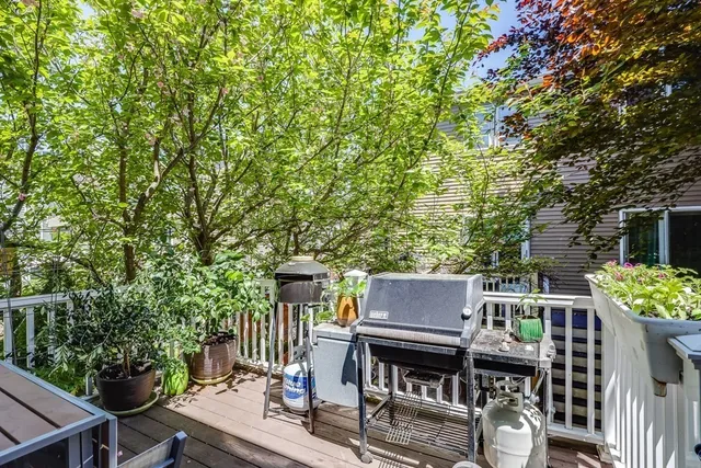 a view of a balcony with furniture