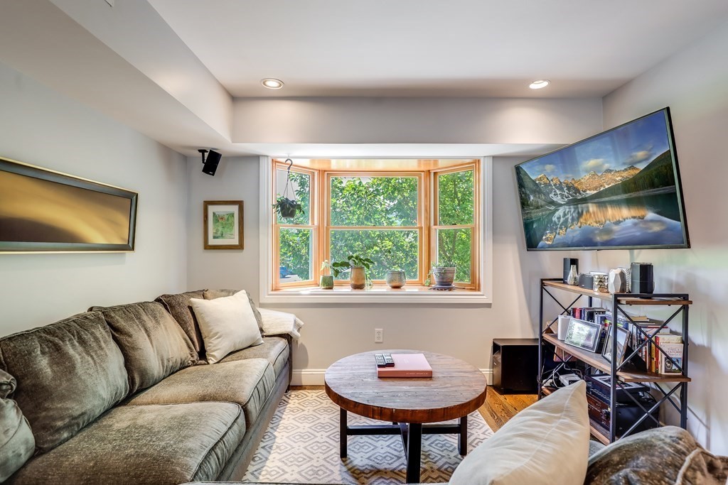 154 West 3rd Street, Unit 154 Boston, MA 02127 - Photo 8 of 26 a living room with furniture and a window