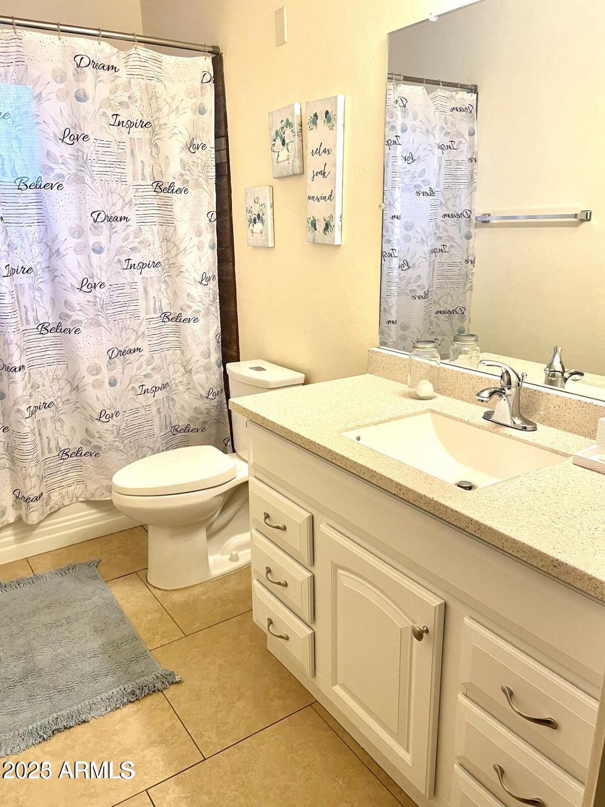 2454 East 14th Street Douglas, AZ 85607 - Photo 11 of 12 a bathroom with a sink toilet and shower