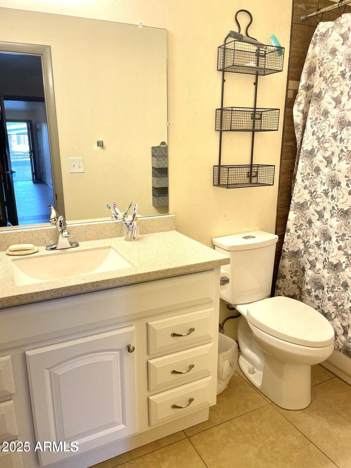 2454 East 14th Street Douglas, AZ 85607 - Photo 12 of 12 a bathroom with a sink a toilet and shower