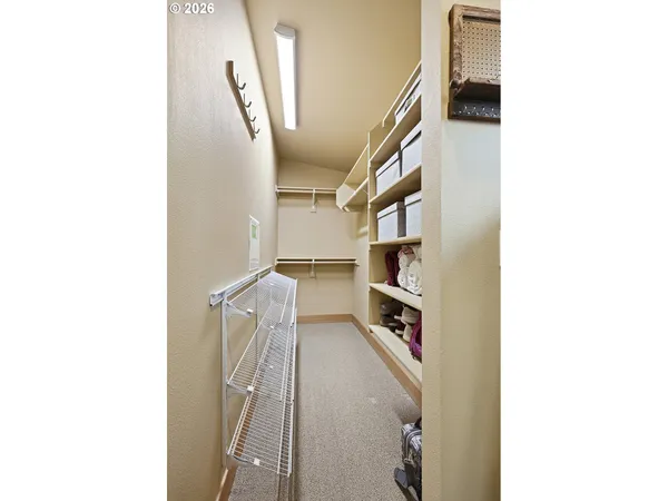 a view of a hallway with a white walls and stairs