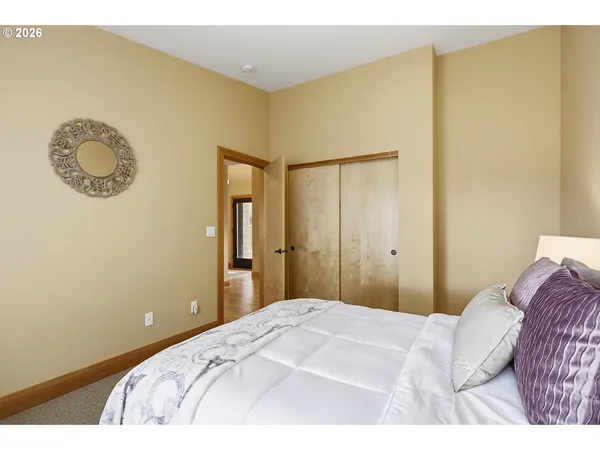 a bathroom with a granite countertop toilet a sink and a shower