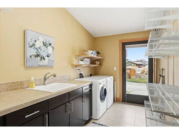 a en suite bathroom with a sink a mirror and a bathtub