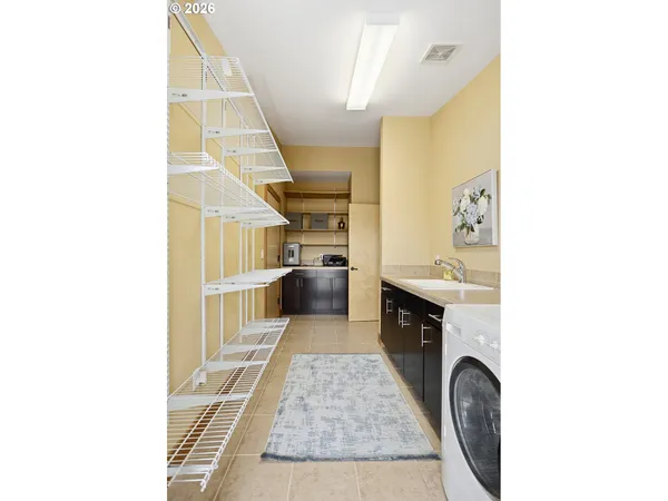 a view of a terrace with couches and wooden fence