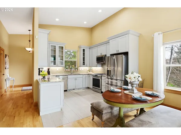 a living room with furniture wooden floor and a fireplace