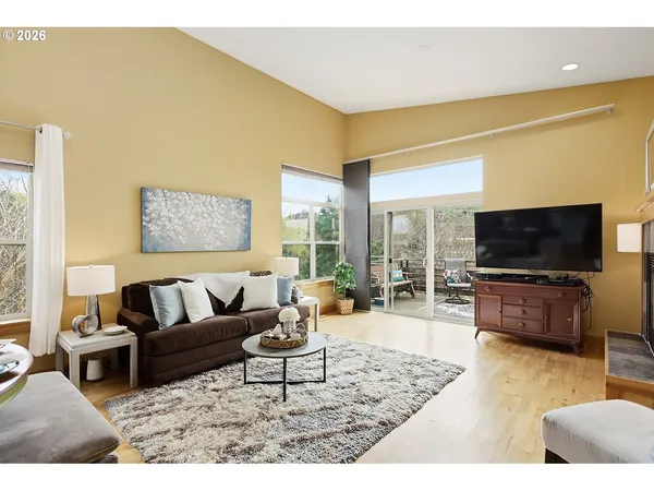 a living room with fireplace furniture and a flat screen tv
