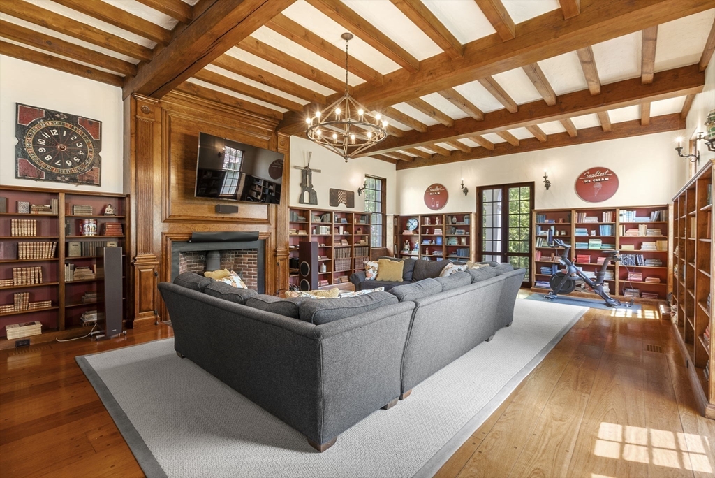 427 Concord Road Sudbury, MA 01776 - Photo 12 of 42 a living room with furniture and a clock