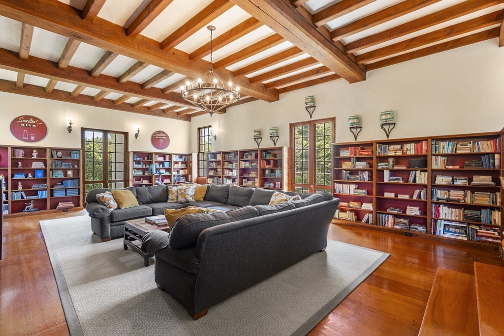 427 Concord Road Sudbury, MA 01776 - Photo 14 of 42 a living room with lots of furniture and a book shelf