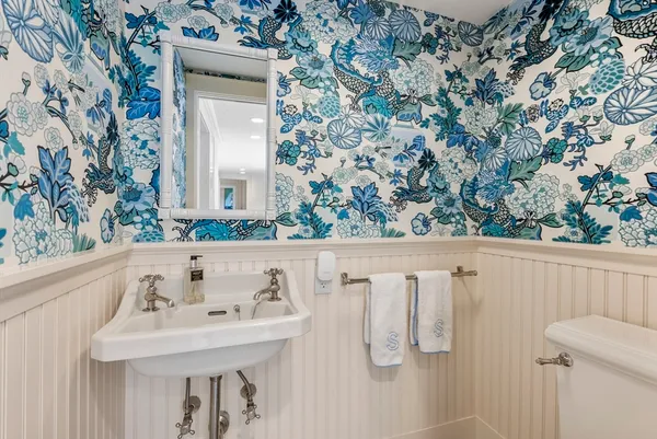 a bathroom with a sink and mirror