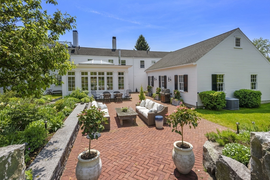 427 Concord Road Sudbury, MA 01776 - Photo 33 of 42 a view of a patio with chairs and potted plants
