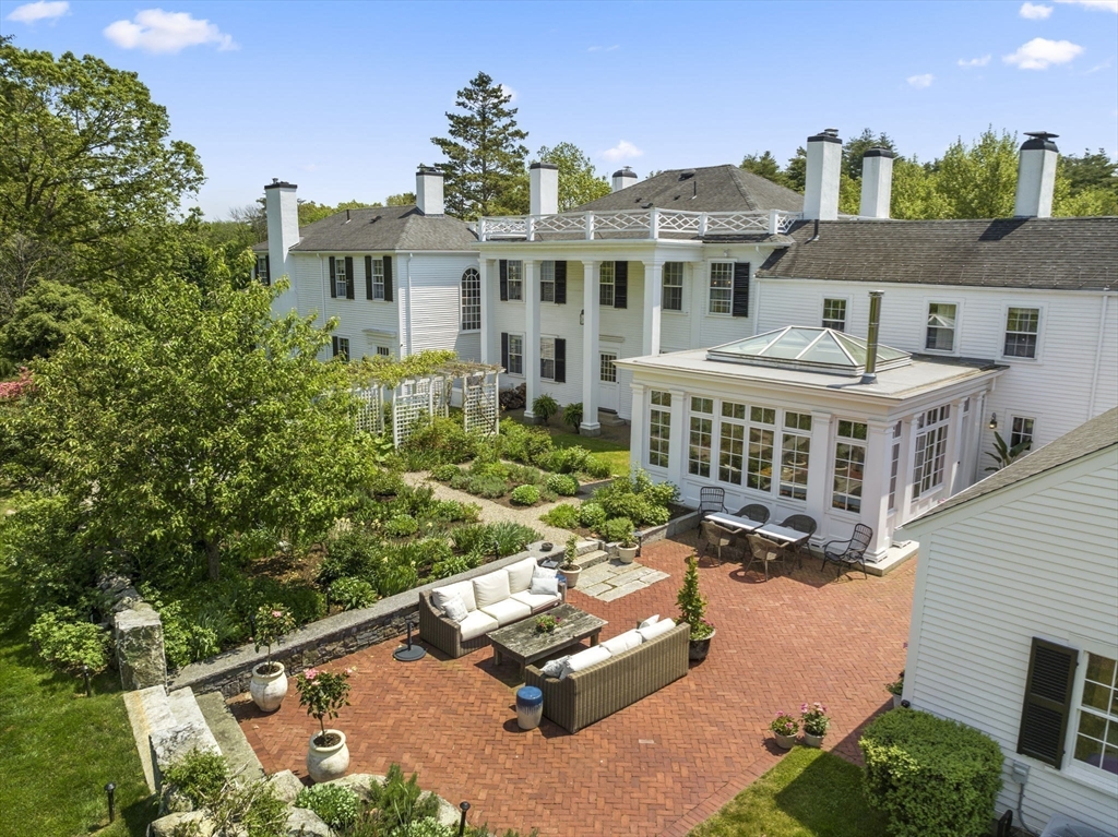 427 Concord Road Sudbury, MA 01776 - Photo 37 of 42 a aerial view of a house with swimming pool and sitting area