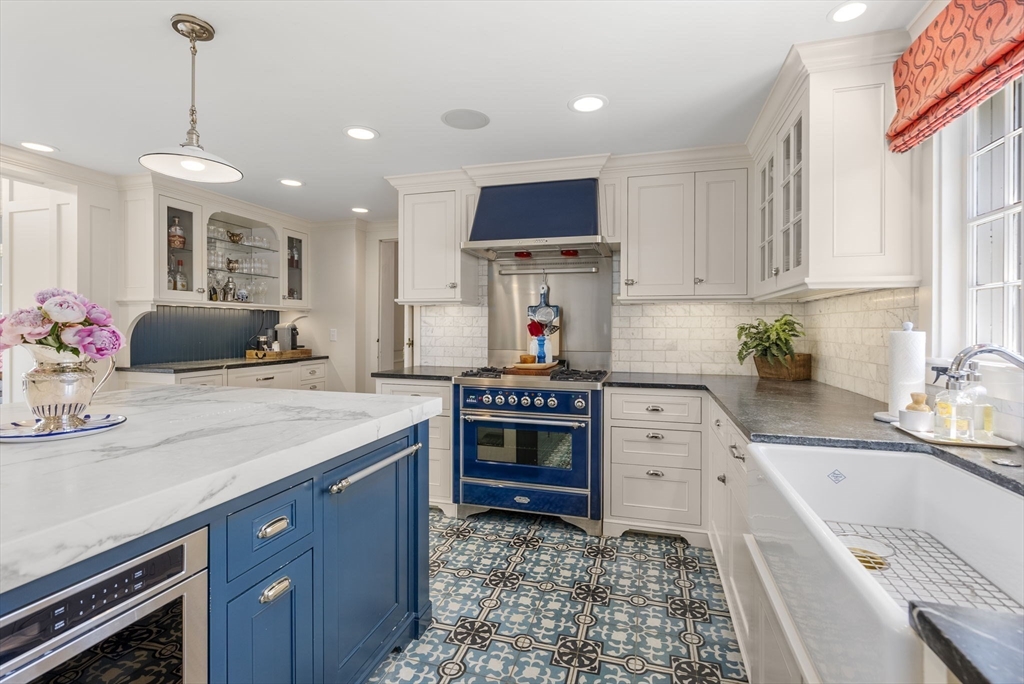 427 Concord Road Sudbury, MA 01776 - Photo 6 of 42 a kitchen with stainless steel appliances granite countertop a sink stove and cabinets