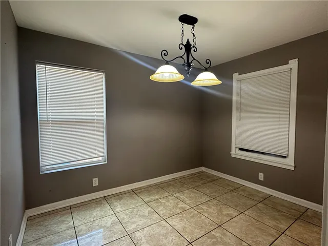 a view of a chandelier fan and window