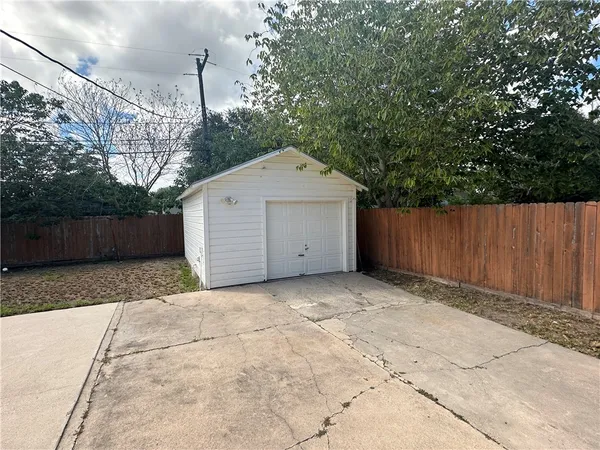 a house with trees in the background