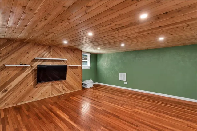 a view of an empty room with a fireplace