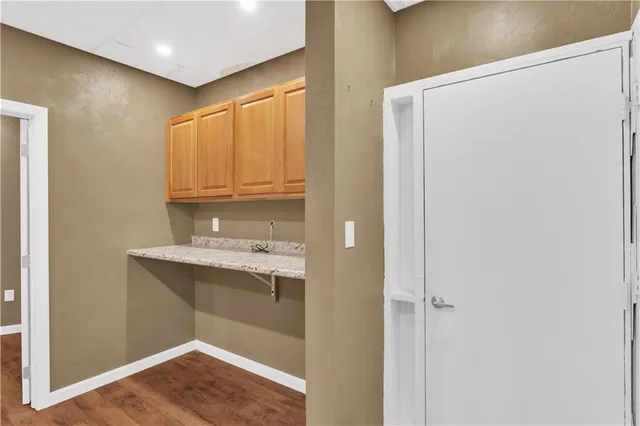 a bathroom with a sink and mirror