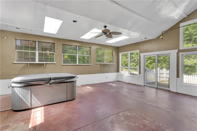 a kitchen with stainless steel appliances granite countertop a stove and a sink with cabinets