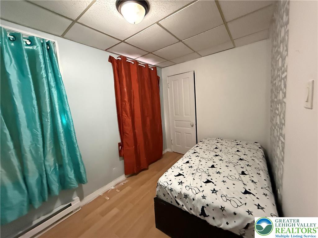 445 Washington Street Allentown, PA 18102 - Photo 16 of 27 a bedroom with a bed and a window