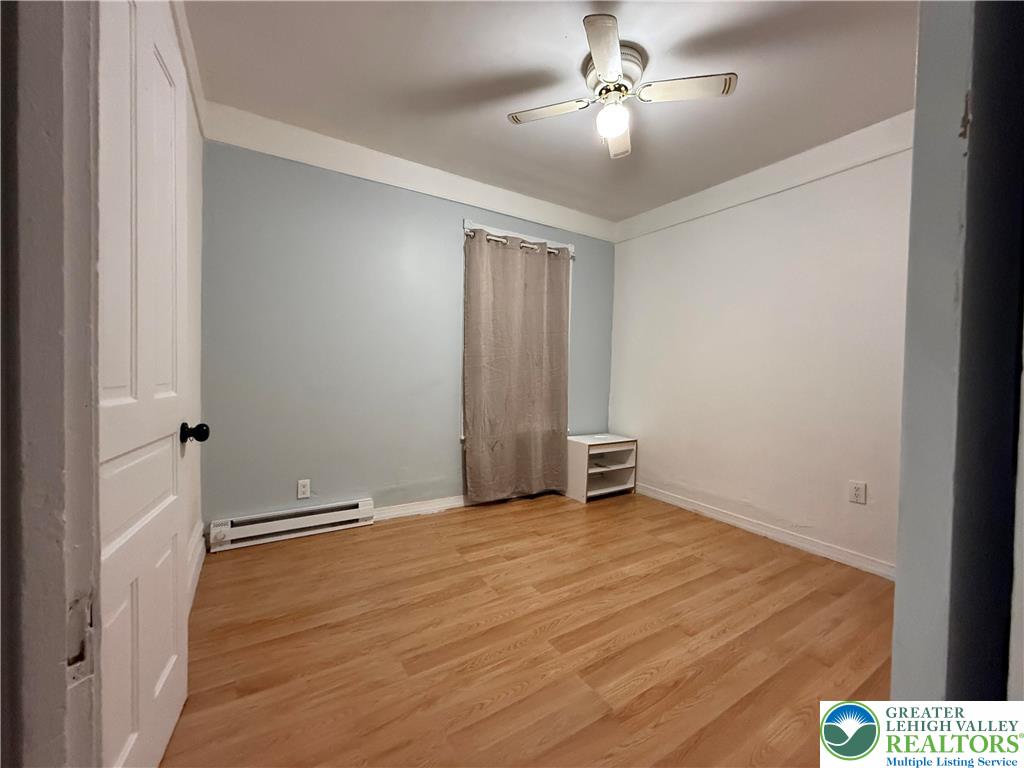 445 Washington Street Allentown, PA 18102 - Photo 17 of 27 an empty room with closet and a ceiling fan