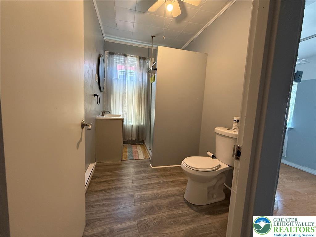 445 Washington Street Allentown, PA 18102 - Photo 18 of 27 a bathroom with a toilet and a shower
