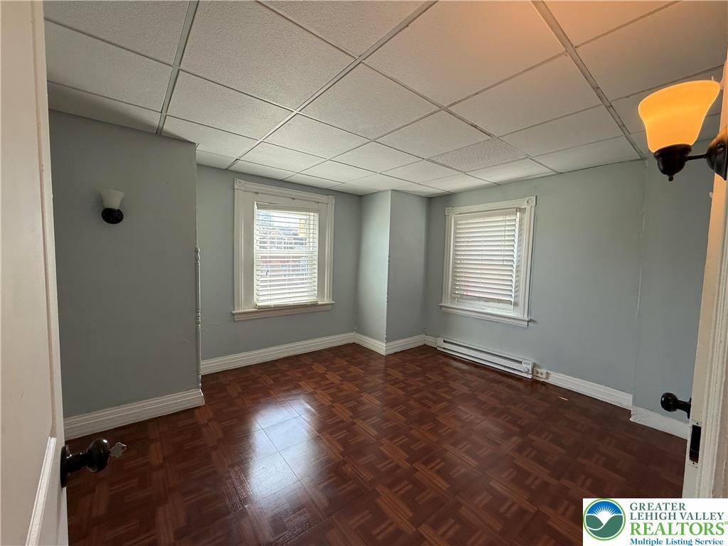 445 Washington Street Allentown, PA 18102 - Photo 21 of 27 a view of an empty room with window and wooden floor