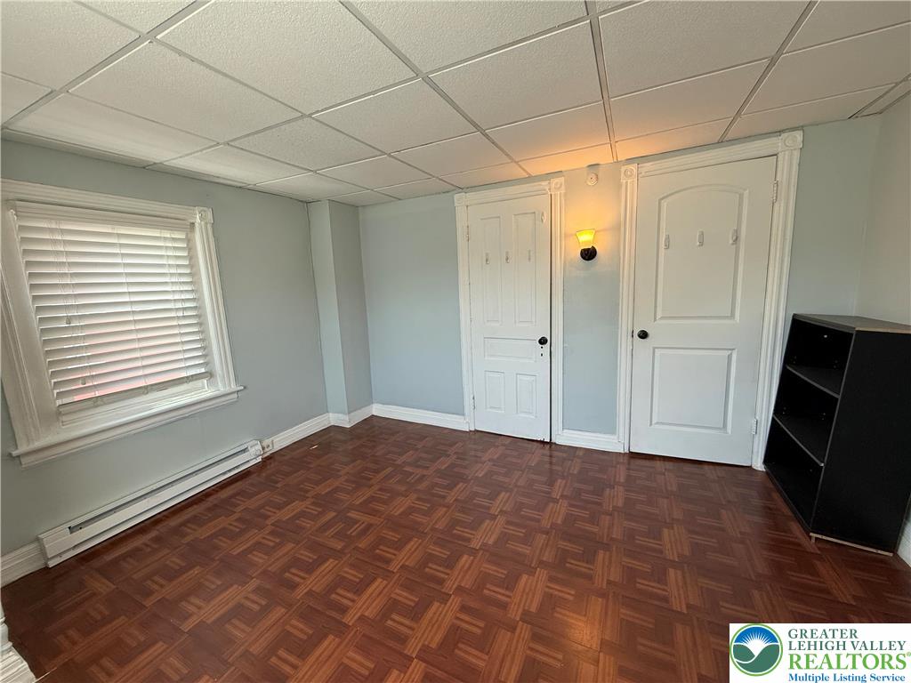 445 Washington Street Allentown, PA 18102 - Photo 22 of 27 a view of empty room with a fireplace and a window