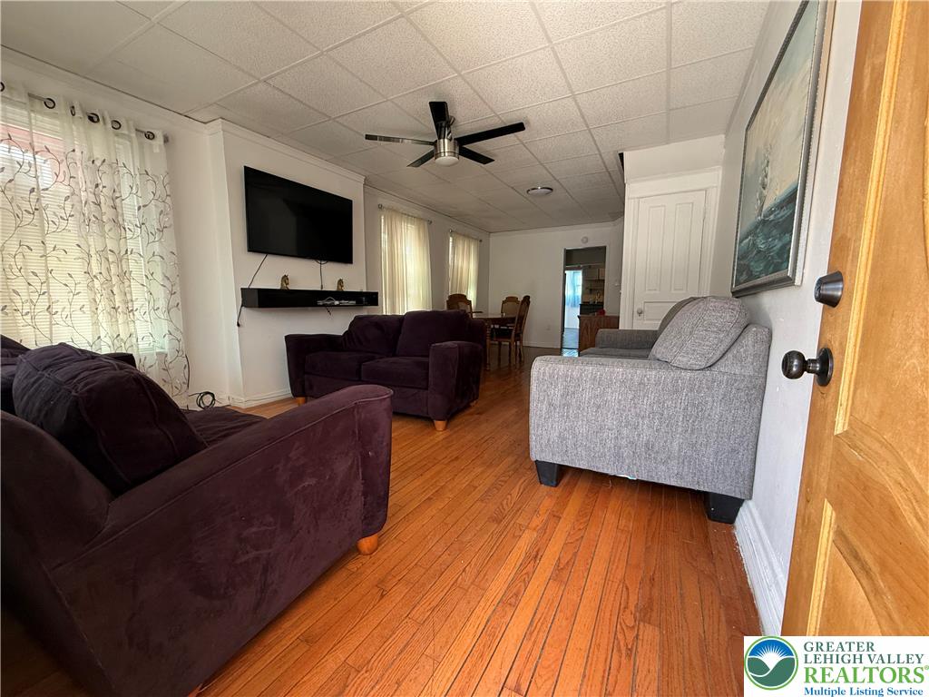 445 Washington Street Allentown, PA 18102 - Photo 3 of 27 a living room with furniture and a flat screen tv