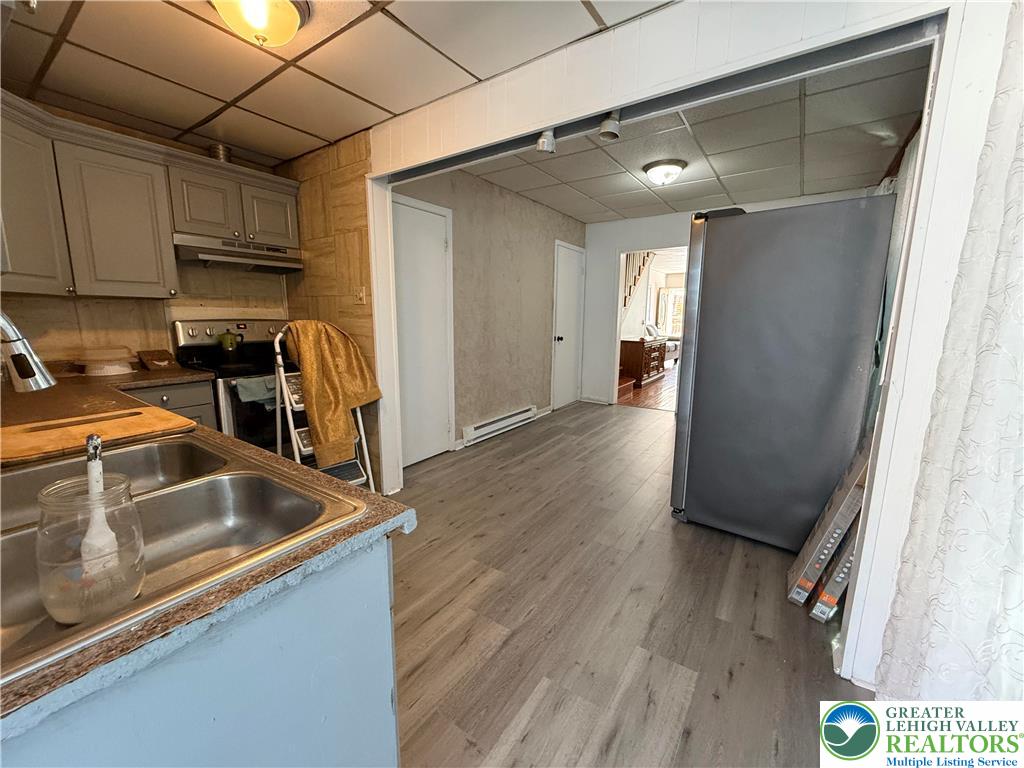 445 Washington Street Allentown, PA 18102 - Photo 7 of 27 a kitchen with a refrigerator and a sink