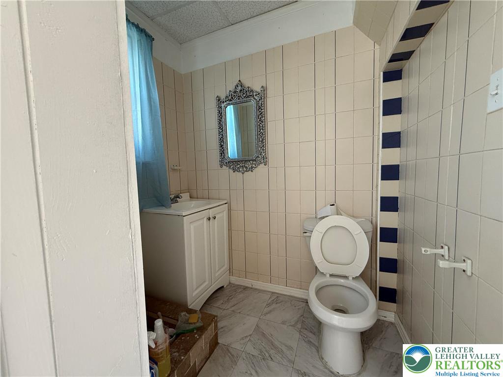 445 Washington Street Allentown, PA 18102 - Photo 10 of 27 a bathroom with a toilet and a sink