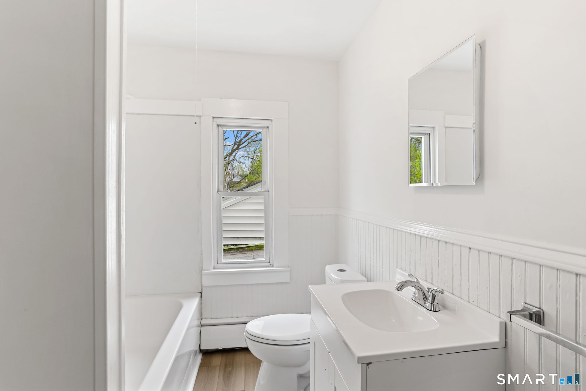 63 Reynolds Street, Unit B Killingly, CT 06239 - Photo 14 of 32 a bathroom with a sink toilet and a mirror